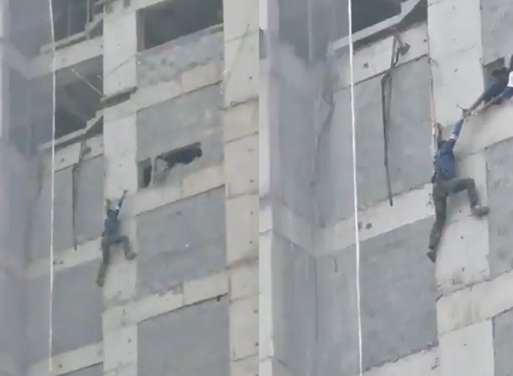 Homem fica pendurado em prédio durante obra no Guarujá; assista